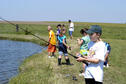 A group of children fishing