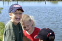 Three kids with a catfish
