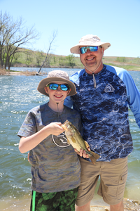 Man and Boy holding fish