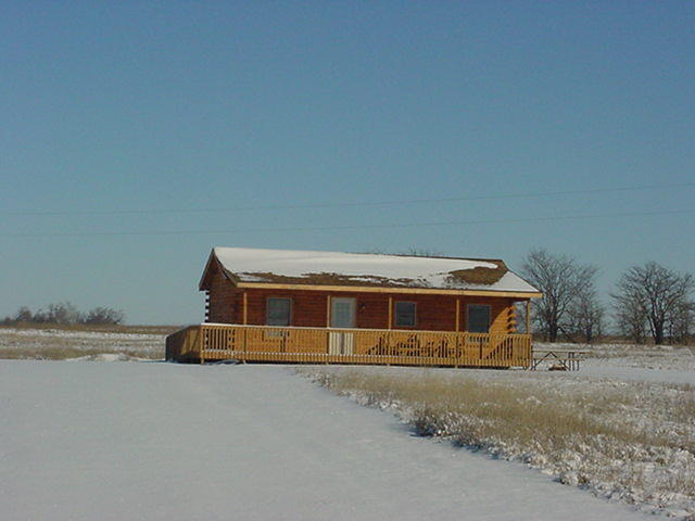 snow covered cabin pic